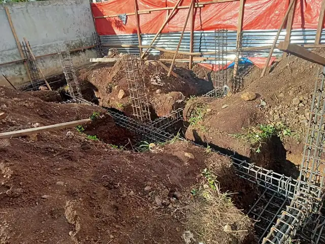 Excavation and footing reinforcement on a construction site
